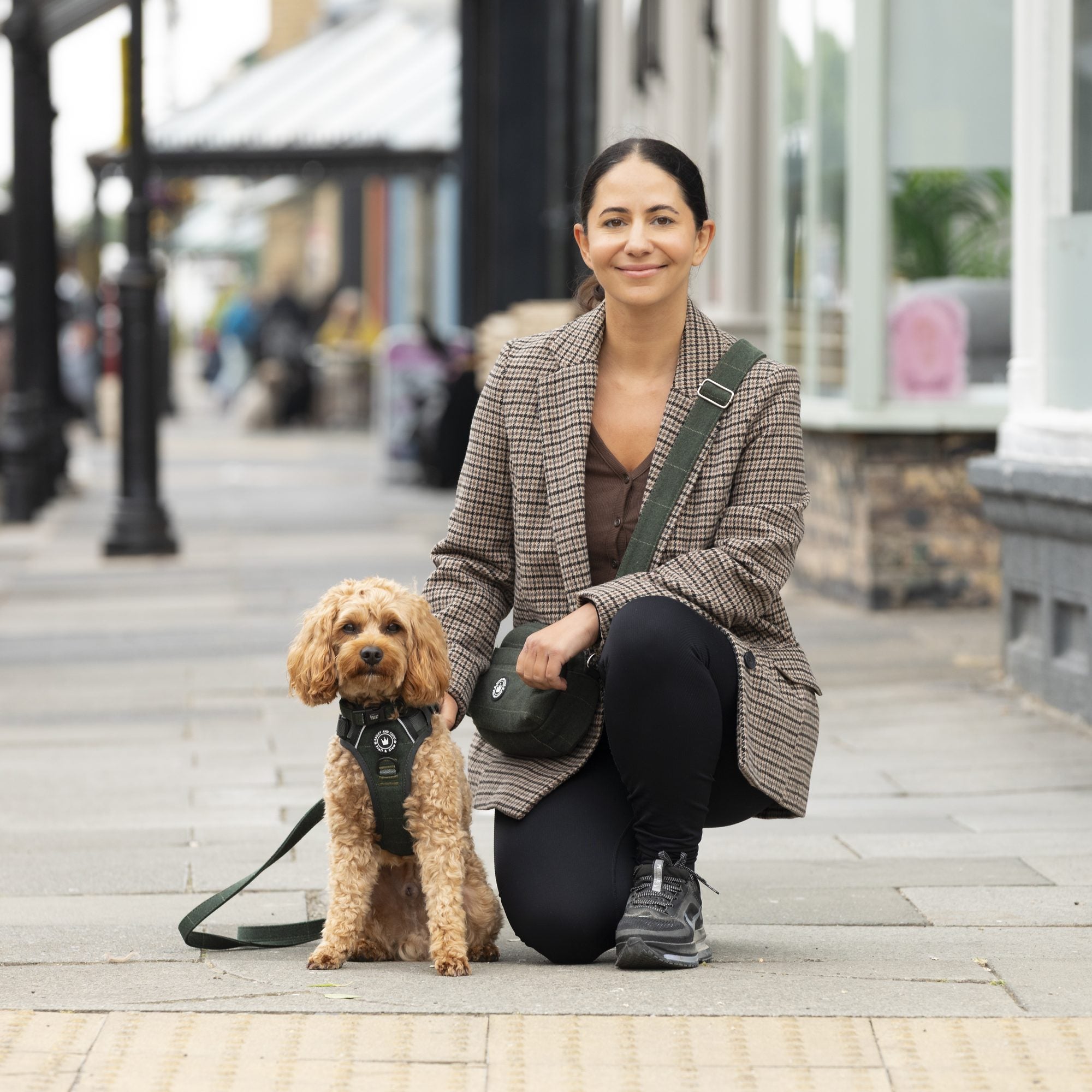 Laura, co-founder of Bailey & Coco, on a town walk with a cockapoo in a Forest Tweed harness and the matching walking bag